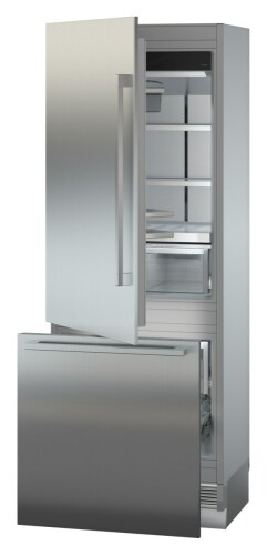 Tall built-in stainless steel refrigerator with open upper door and open bottom freezer drawer in appliances collection