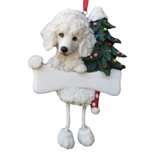 White poodle ornament with dangling legs holding a blank bone sign and a decorated Christmas tree with lights