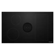 Black cooktop featuring induction heating zones with downdraft vent, part of KitchenAid induction cooktops collection