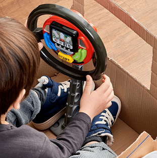 Child playing with electronic steering wheel toy featuring a screen and colorful buttons in pretend play toys under $50 collection