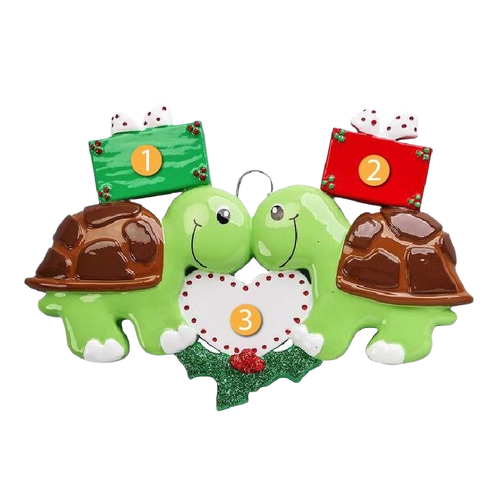 Pair of green turtle ornaments with brown shells holding gift boxes and a white heart, Christmas decor under $50 collection