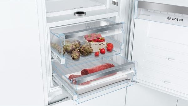 built-in bottom freezer refrigerator drawer with fresh produce and meat in Bosch appliances collection