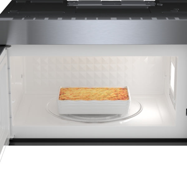 Stainless steel over-the-range microwave interior with LED lighting and casserole dish inside from Appliances collection