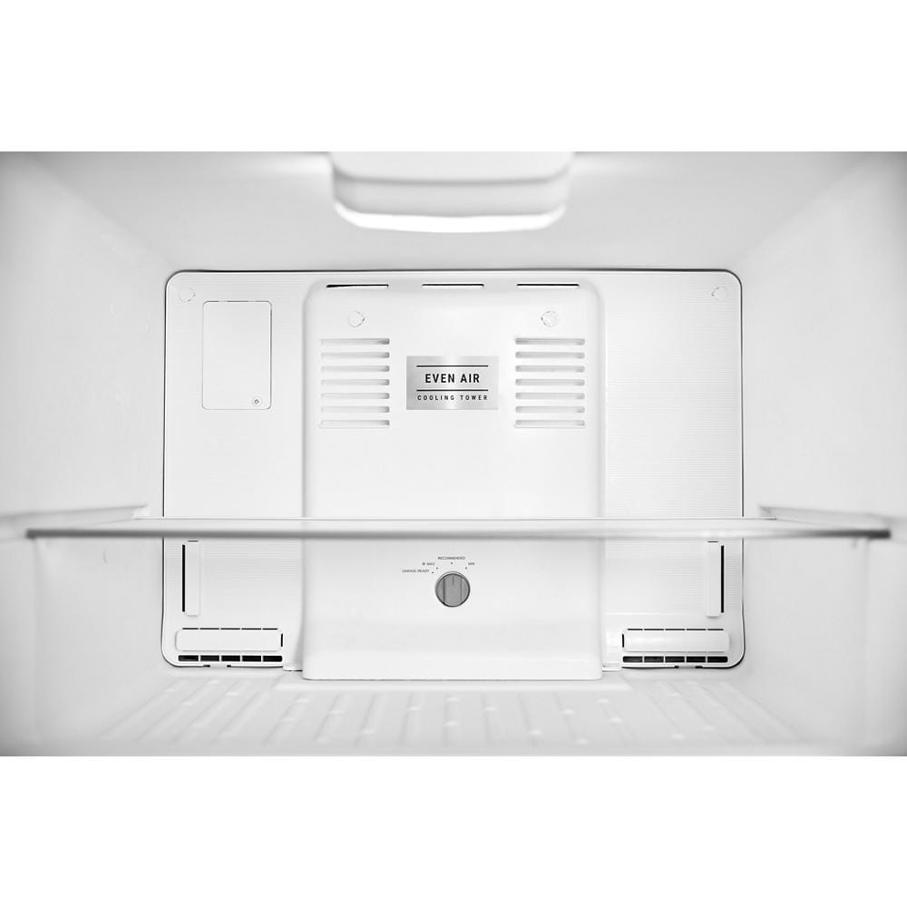 Interior view of white top-freezer refrigerator showing EvenAir cooling tower and adjustable glass shelf detail