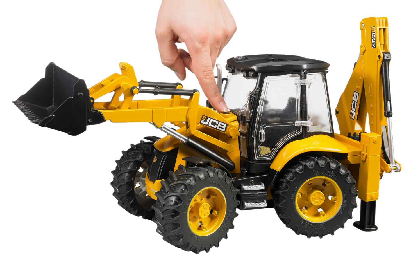 Hand operating the movable arm of a yellow Bruder Toys JCB 5CX Eco backhoe loader in toy collections under $100