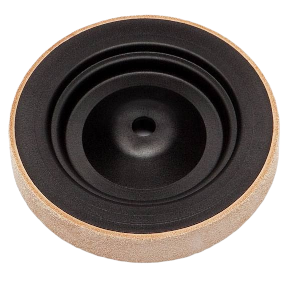 Round leather honing wheel with black center and natural tan outer surface for sharpening and tool maintenance
