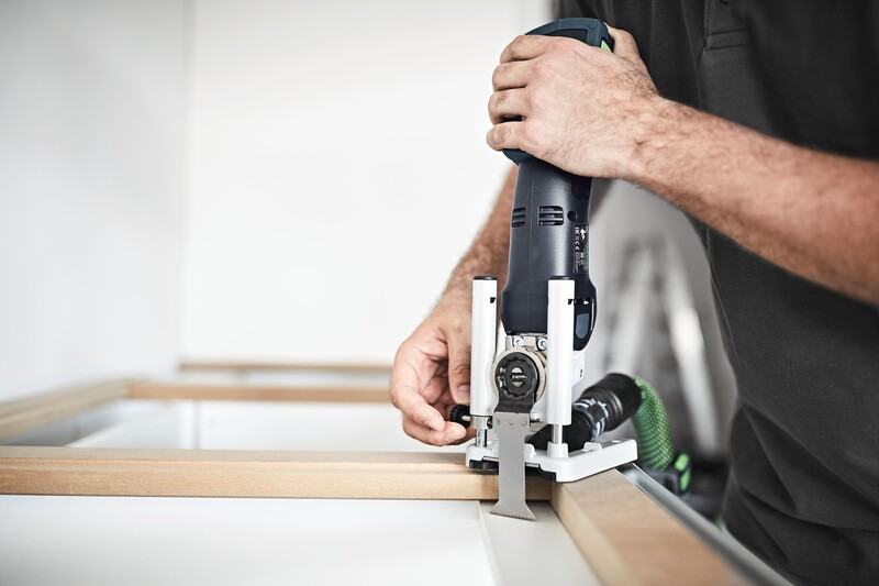 Person using a Festool plunge base accessory on a power tool for precise plunge cuts in woodworking tool accessories collection