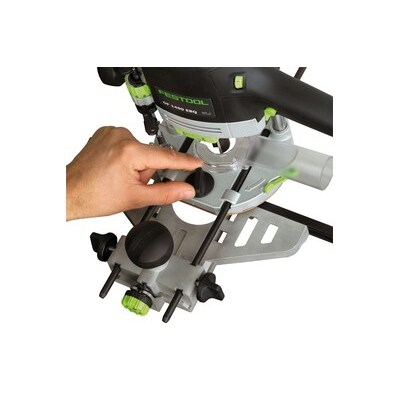 Hand adjusting the precise depth setting on a Festool woodworking router for accurate home improvement tasks