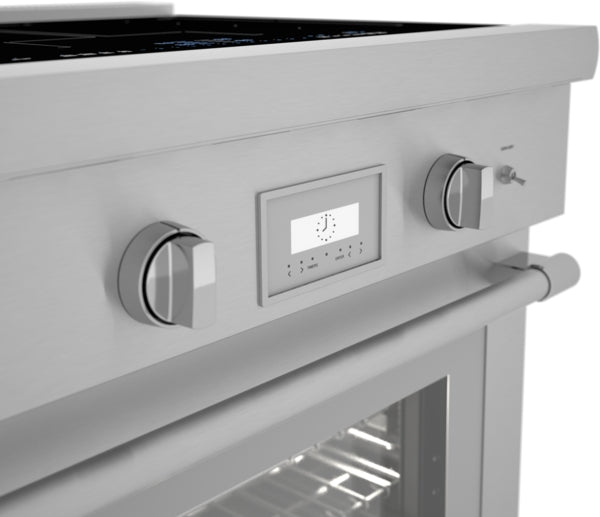 Close-up of stainless steel induction range control panel with two knobs, digital display, and oven door handle in modern kitchen setting