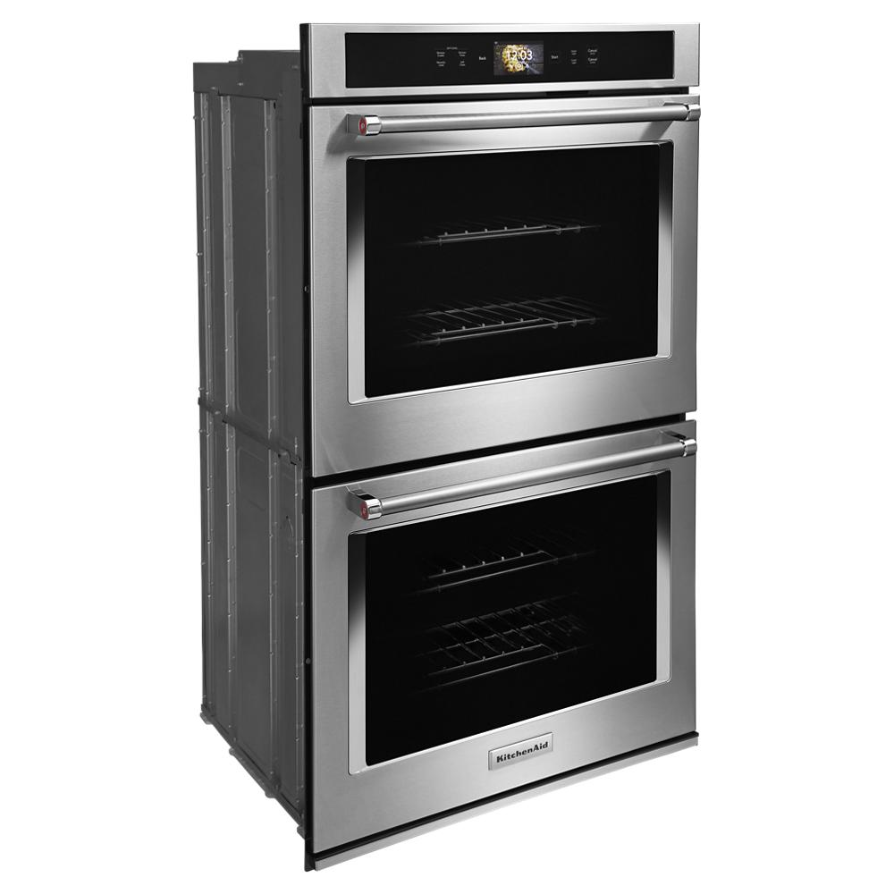 Double oven unit with stainless steel finish, digital display, and modern design from KitchenAid wall ovens collection