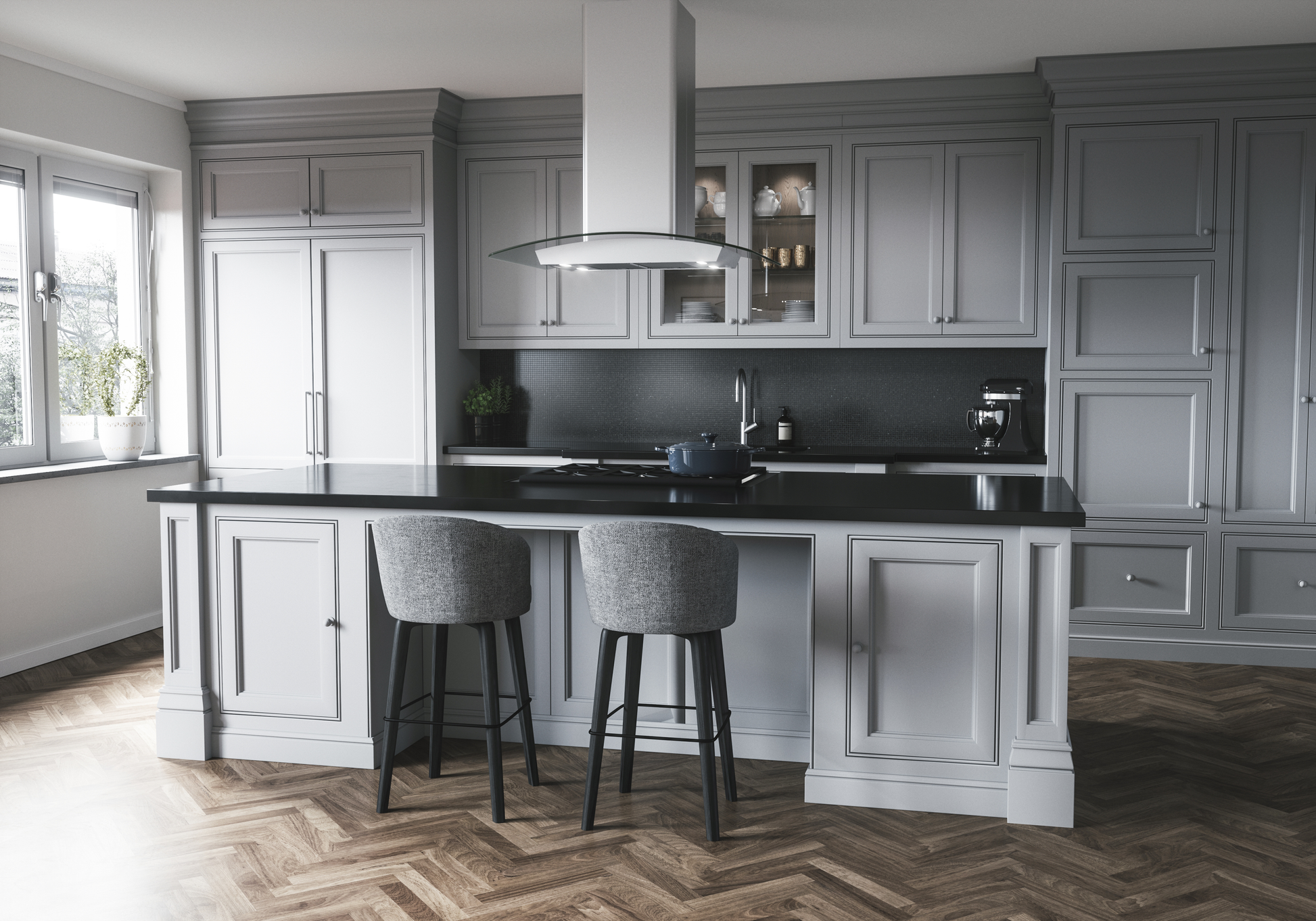 Modern stainless steel island hood with LED lighting over gray kitchen island in spacious kitchen and home improvement setting