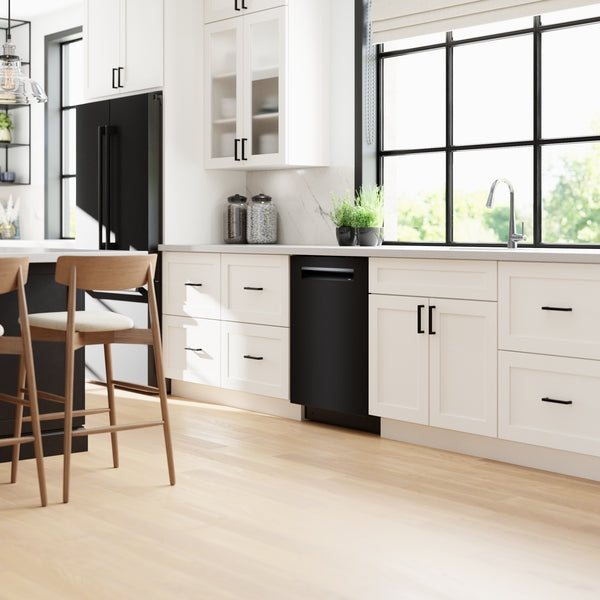 Modern kitchen with black dishwasher integrated under white cabinetry, featuring wood flooring and large window in Kitchen collections
