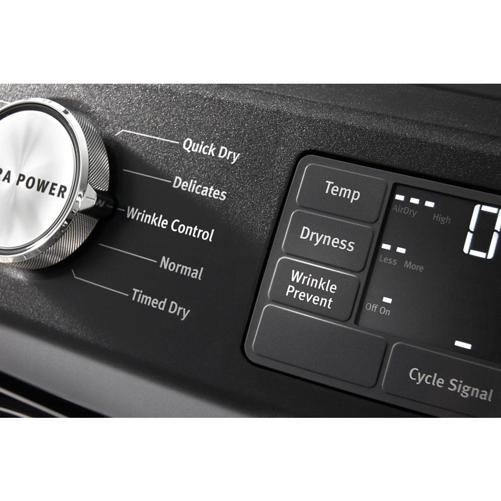 Close-up of black front load dryer control panel showing cycle selector and digital settings for temperature and dryness