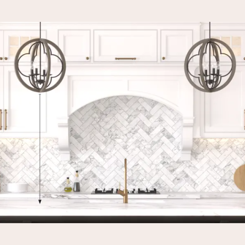 Pair of four-light pendant fixtures with rustic iron frames and French oak rings over a marble kitchen island countertop