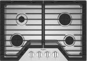 Black 30-inch gas cooktop with four burners, front control knobs, and EZ-2-Lift hinged cast-iron grates from kitchen collection