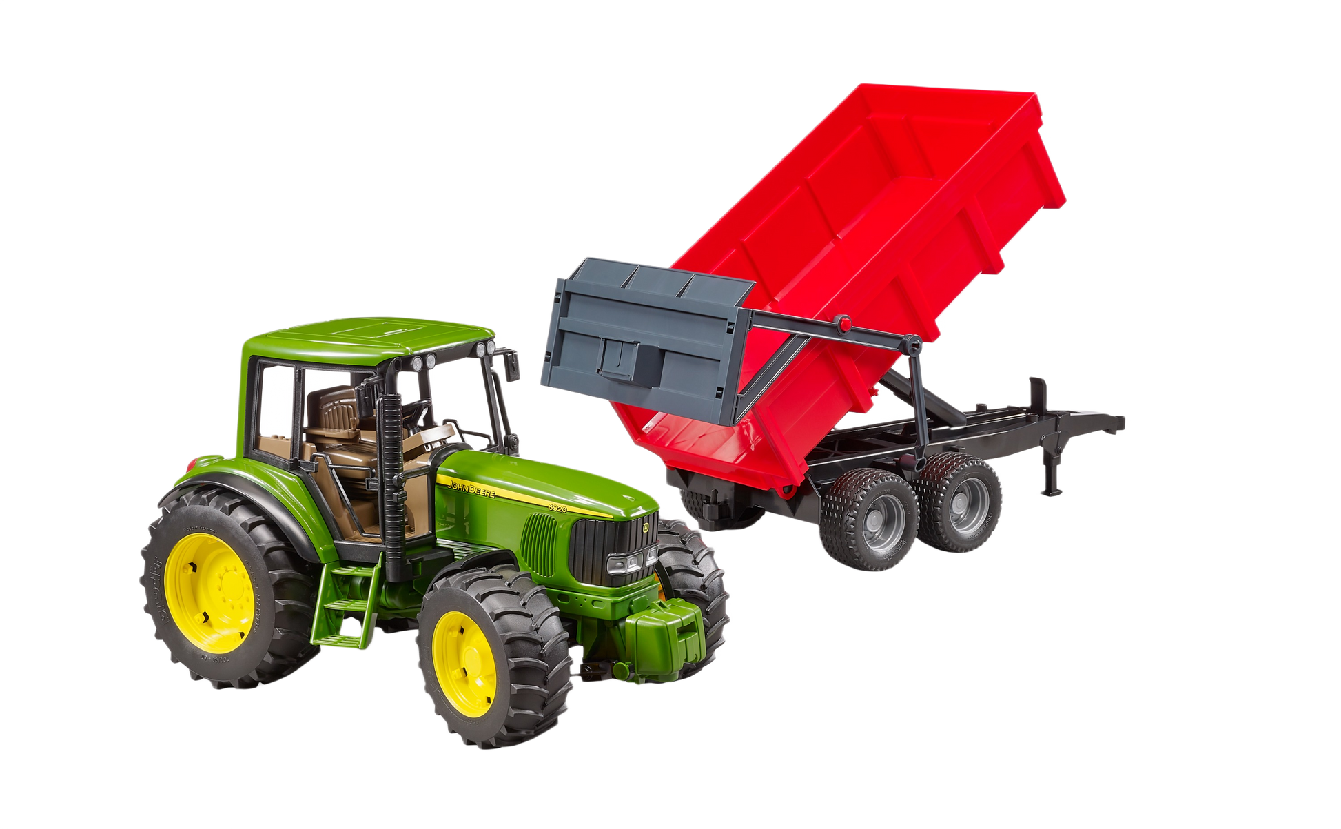 Green and yellow toy tractor attached to a red tipping trailer for imaginative farm play and model display