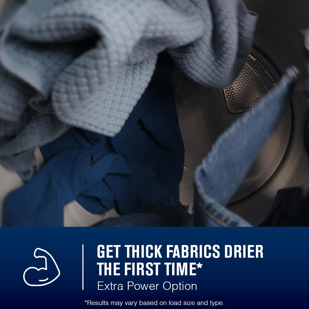 Close-up of mixed thick fabrics inside a top load gas dryer drum promoting extra power drying option from Dryers collection