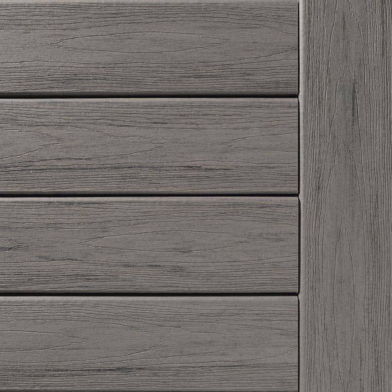 Close-up of driftwood-colored composite decking boards with square shoulder design for home improvement projects