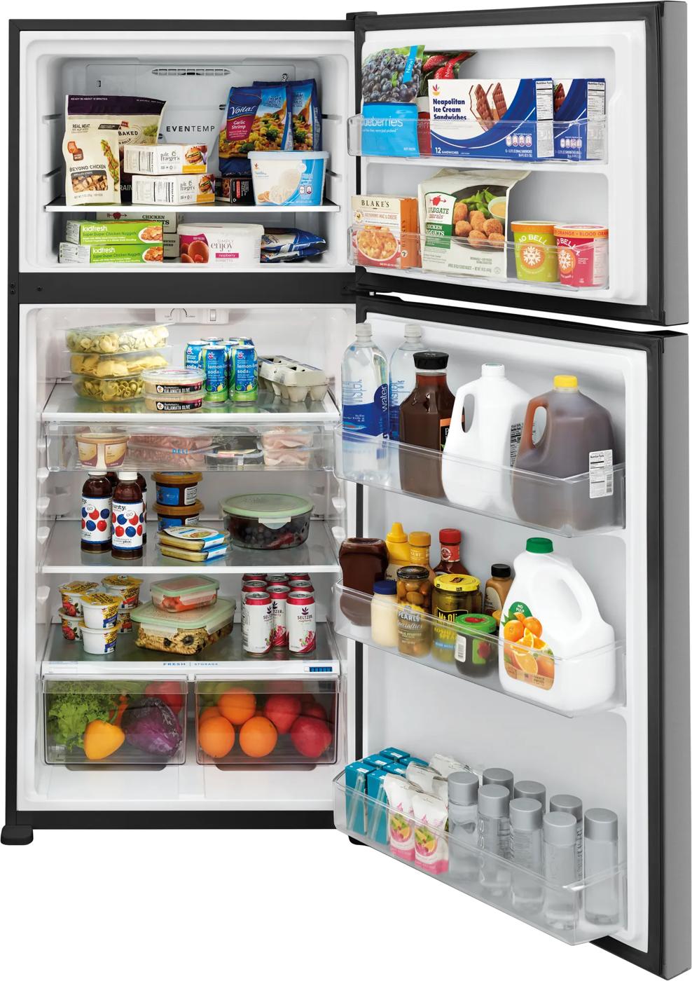 Open black top freezer refrigerator filled with groceries, organized shelves and door compartments in kitchen appliances collection