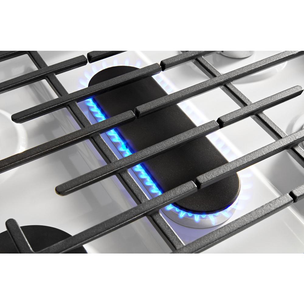 Close-up of edge to edge cast-iron grates over two high BTU gas burners on freestanding range in kitchen appliance collection