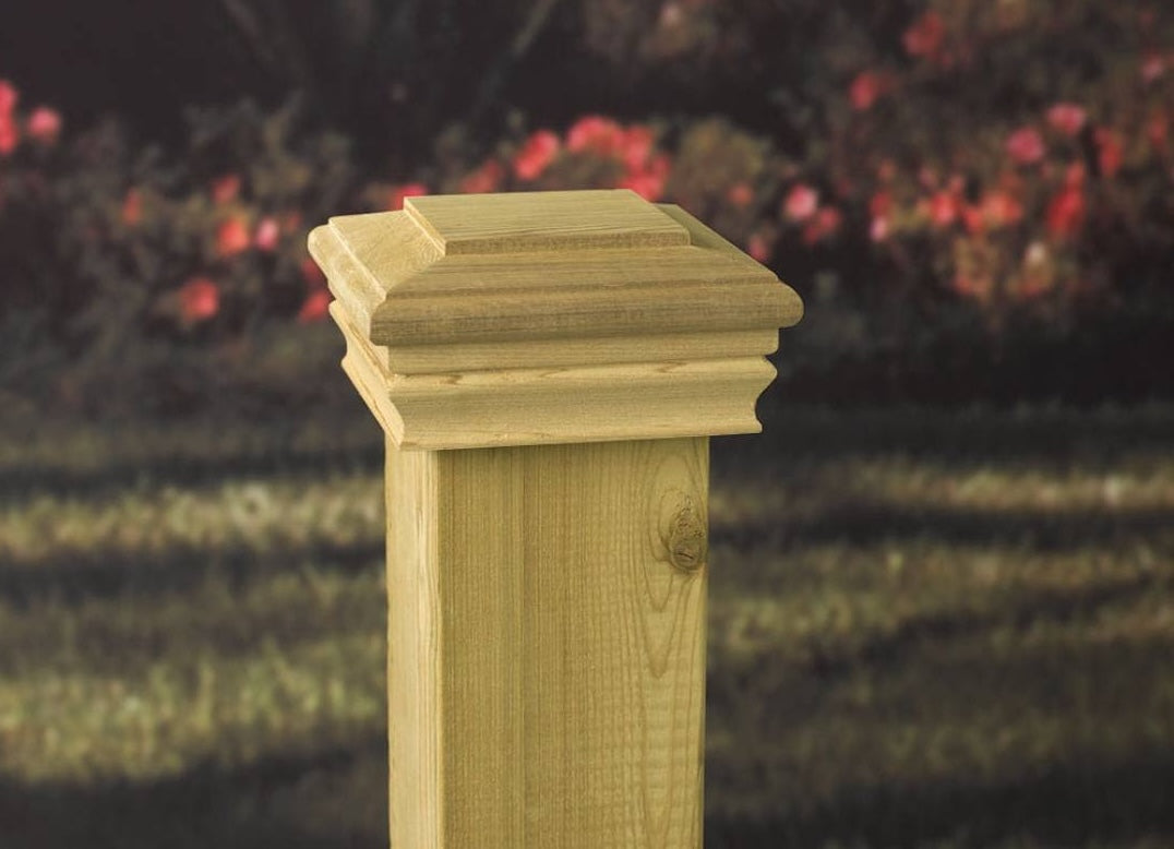 Classic style pressure-treated wood post cap designed for enhancing outdoor deck and fence posts in home improvement projects