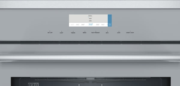 Close-up of stainless steel single wall oven control panel with digital temperature display and touch controls from Thermador kitchen appliances collection