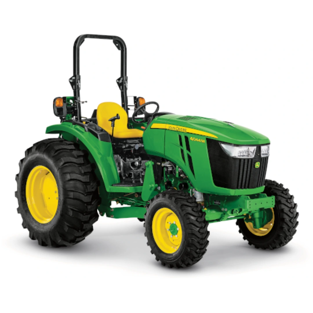 Green and yellow open station compact utility tractor with durable tires designed for outdoor and home improvement tasks