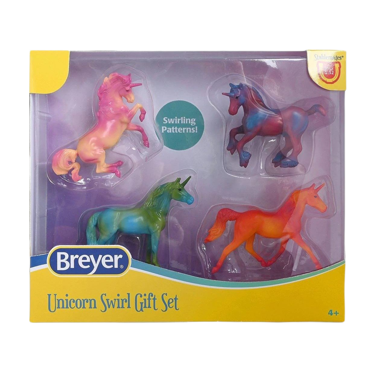 Set of four colorful unicorn figurines with swirling patterns in a gift box for imaginative play and collection