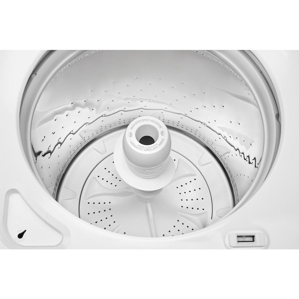 Top load washer interior showing stainless steel wash basket and central high-efficiency agitator from appliances collection