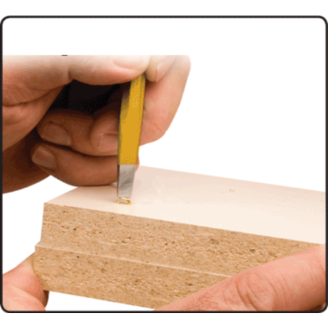 Handheld staple setter with yellow handle being used to fasten staples into wood for home improvement tasks
