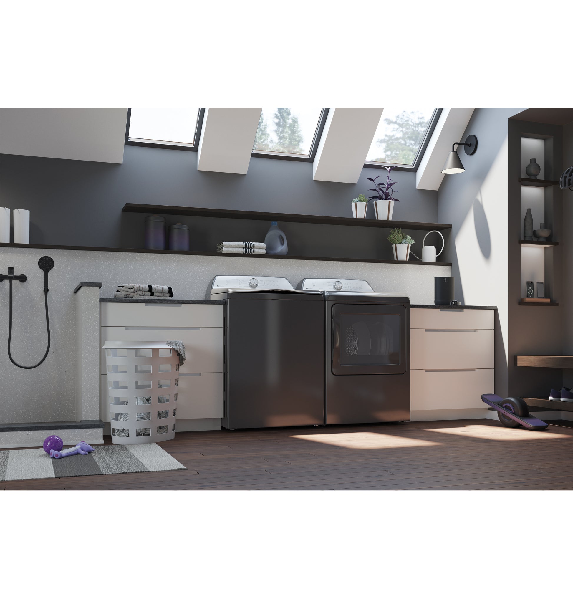 Modern black electric dryer and matching washer in bright laundry room with skylights, shelving, and home accessories from Dryers collection