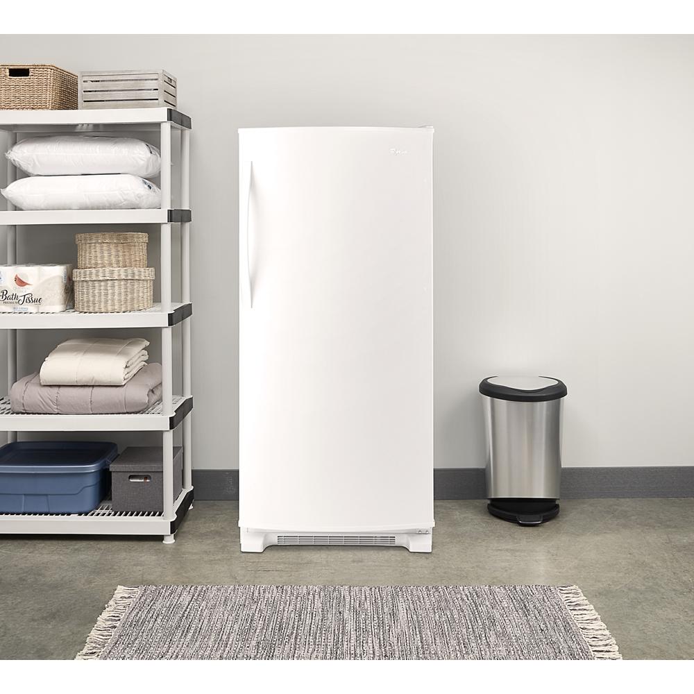 White all refrigerator with single door beside metal shelving and silver trash can in kitchen appliances and home improvement collections