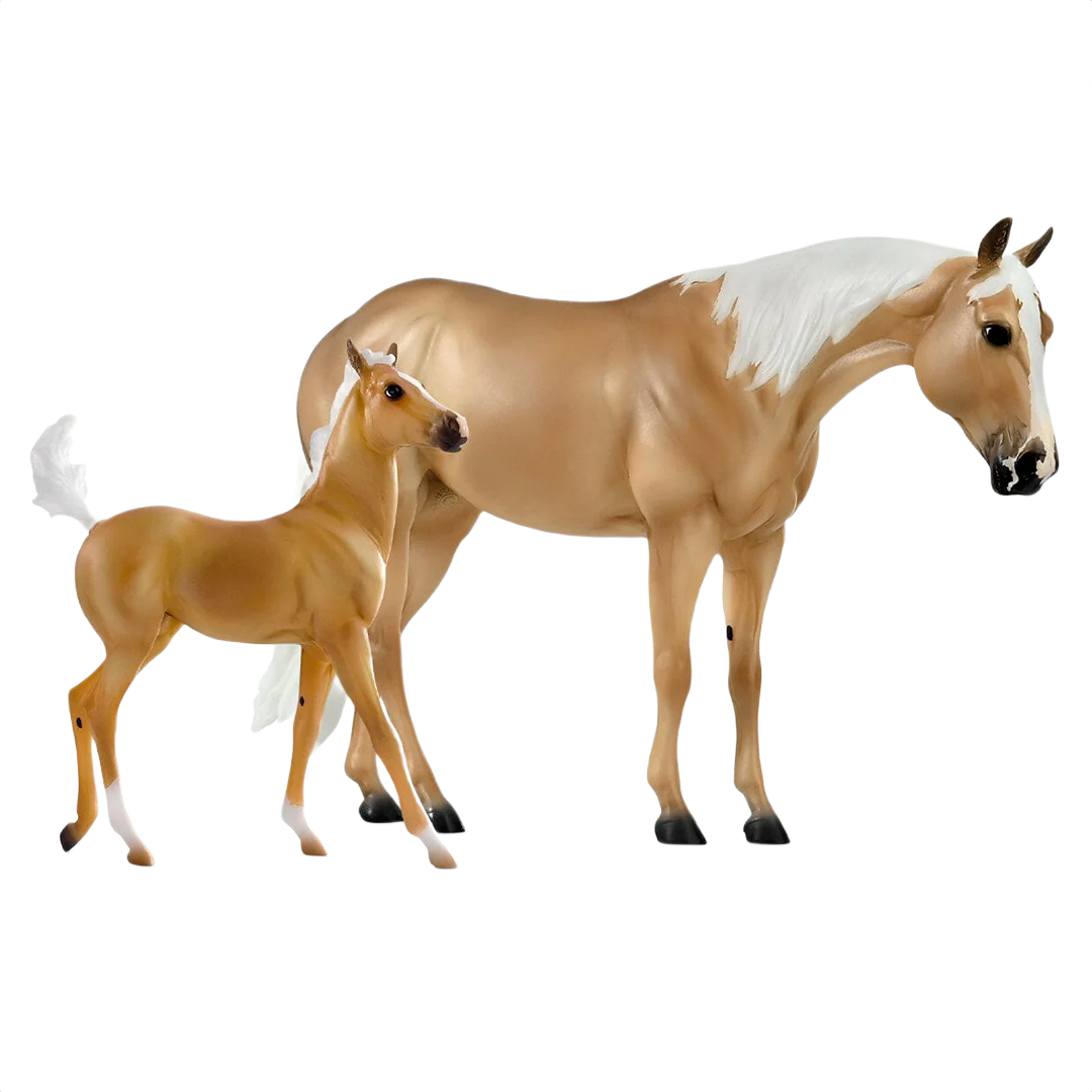 Realistic model set of a tan mare and foal with white mane and tail, showing detailed equine features and posture