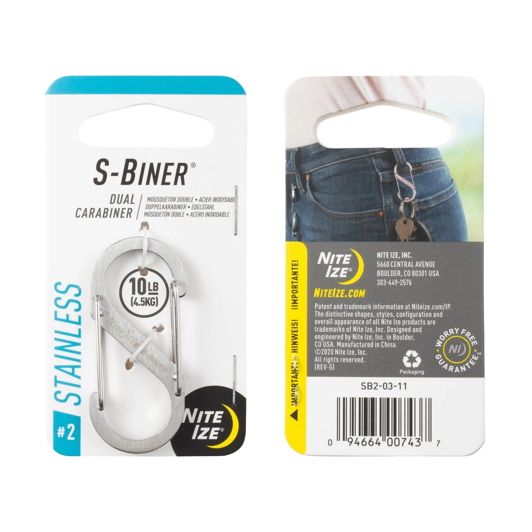 Stainless steel dual carabiner clipped to denim jeans, shown in packaging for hardware and storage use