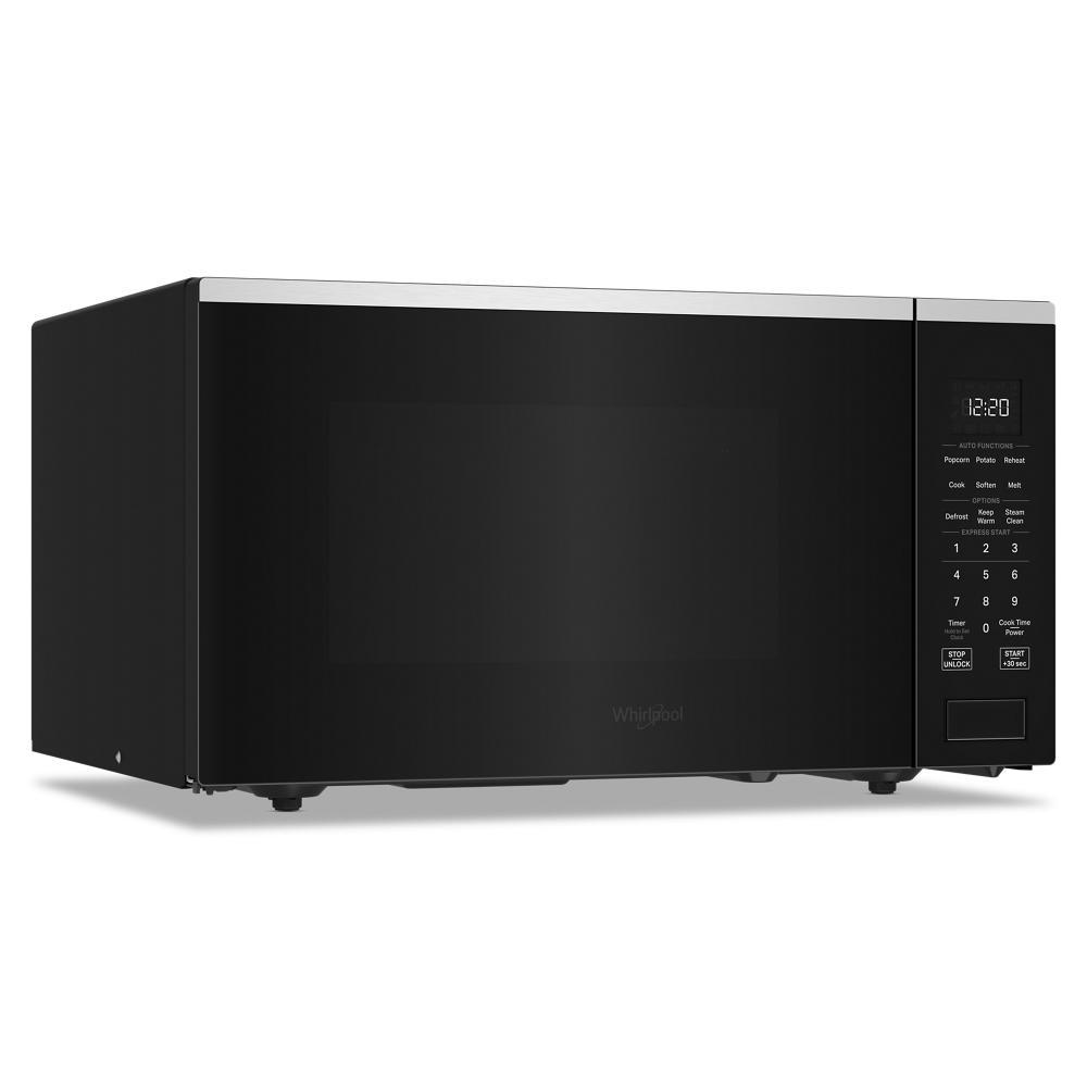 Black Whirlpool microwave with sensor cooking, digital control panel, and stainless steel trim in kitchen appliances collection