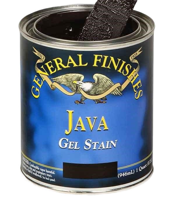 Open can of dark brown gel stain with applicator brush dipped inside for wood finishing projects