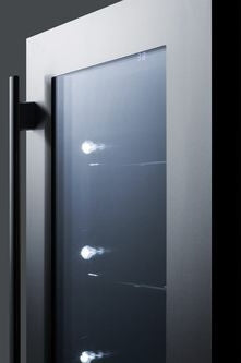Close-up of a stainless steel beverage center door with T4 tinted glass and black handle in kitchen appliance setting
