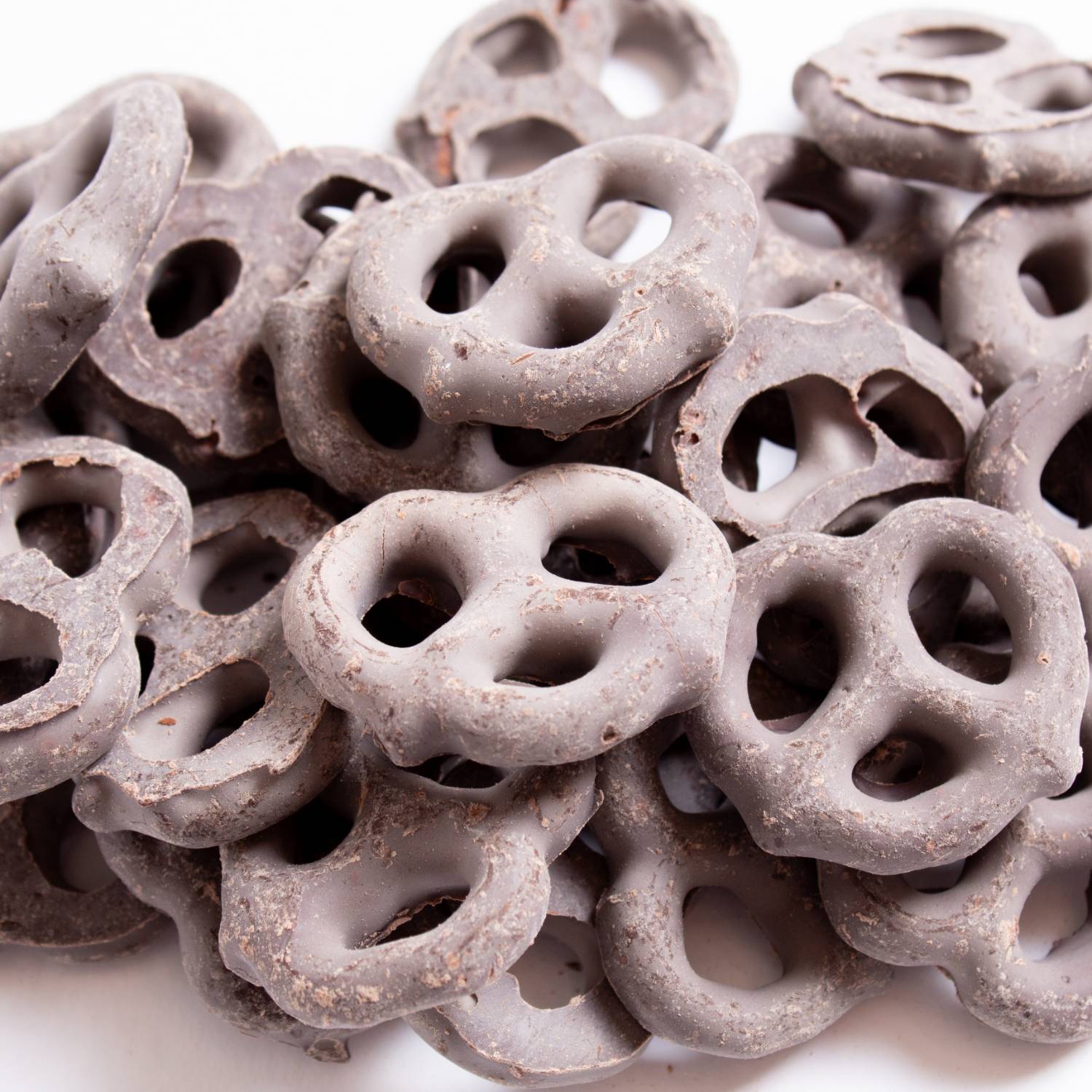 Close-up of mini pretzels coated in dark chocolate from Chips & Snacks and Food & Beverage under $50 collections