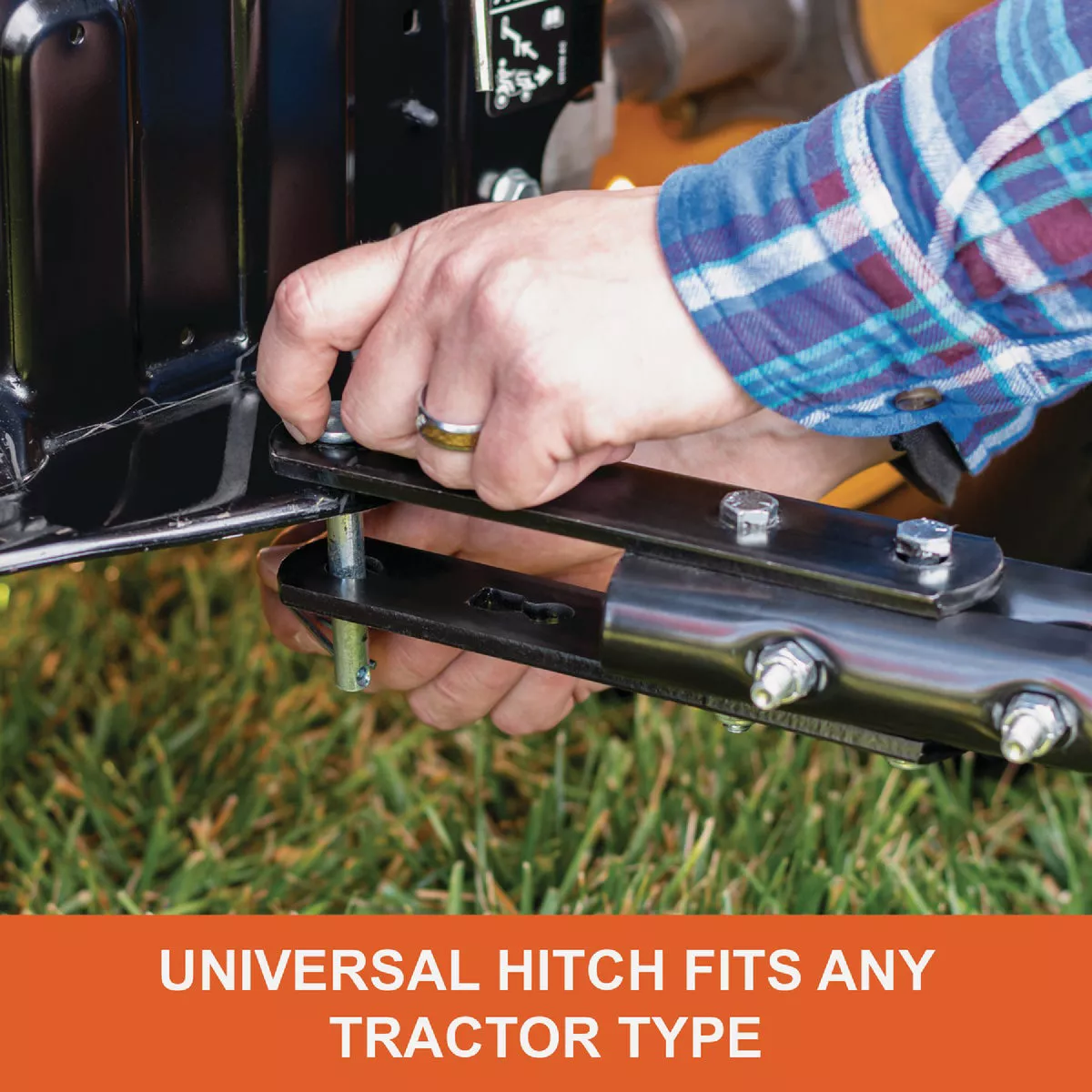 Person attaching universal hitch on metal frame of lawn tool, demonstrating fit for various tractor models in home improvement tools collection