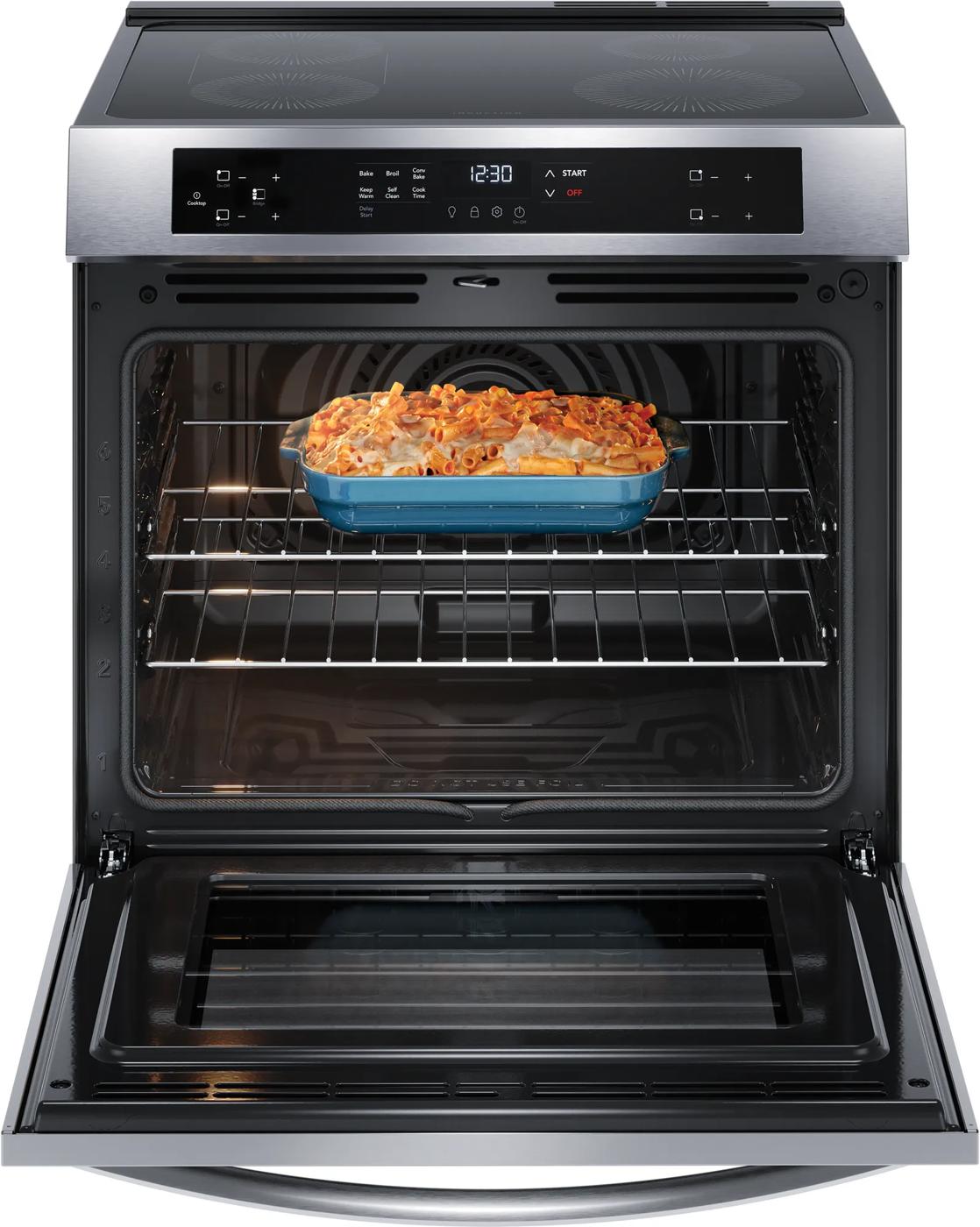 Freestanding stainless steel range from Ranges collection with convection oven and baked pasta dish inside oven cavity
