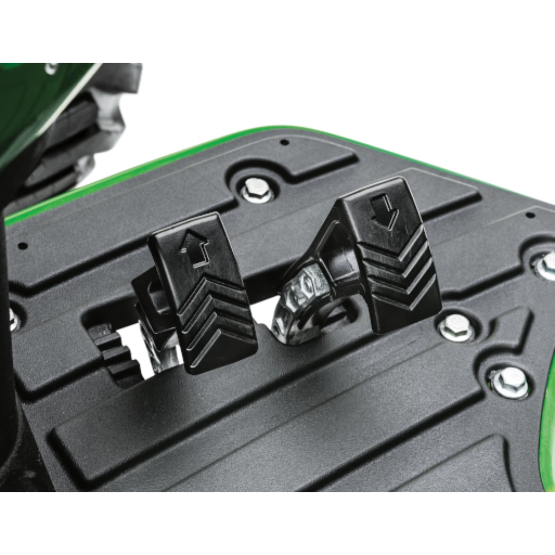 Close-up of two black metal pedals with directional arrows on the floor panel of a John Deere 4052M Heavy-Duty Compact Tractor in Outdoor Power Equipment at Hartville Hardware