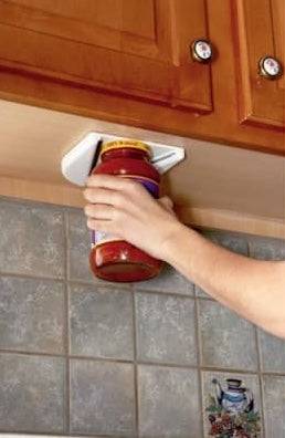 White kitchen jar vise mounted under wooden cabinet for secure grip in kitchenware collections under $50