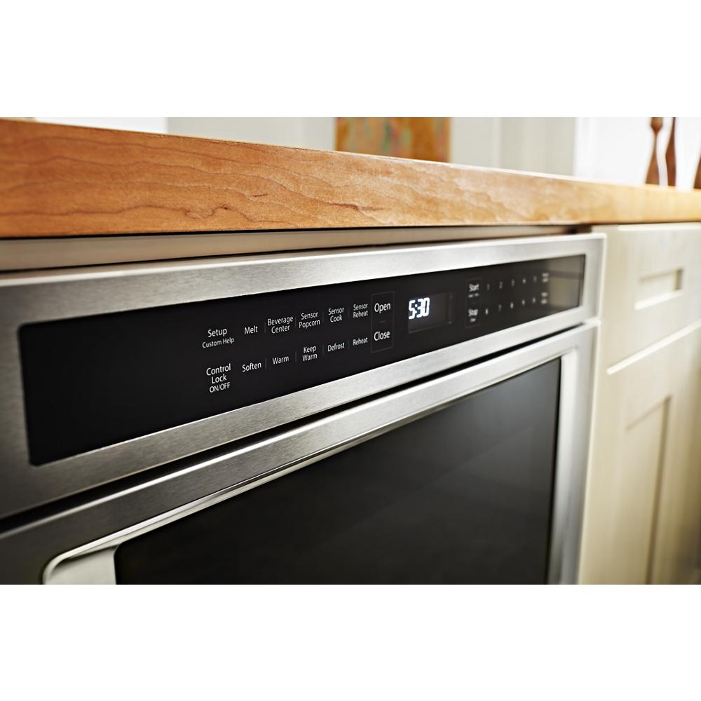 Close-up of stainless steel microwave drawer control panel with digital display and preset cooking options from KitchenAid collection