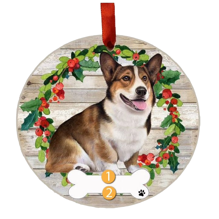 Round wooden Christmas ornament featuring a happy Welsh Corgi inside a festive holly and berry wreath decoration