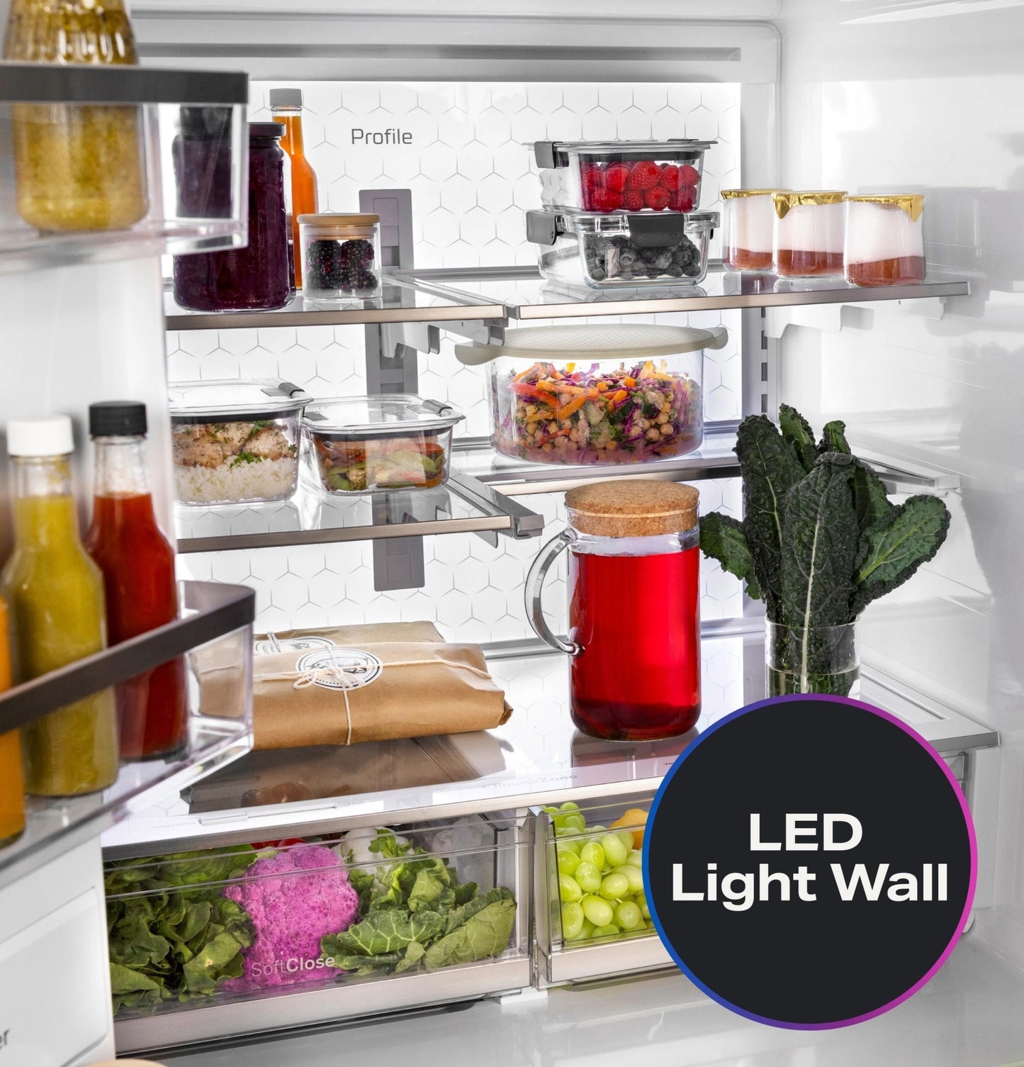 Interior of fingerprint resistant French-door refrigerator with clear storage containers and LED light wall feature