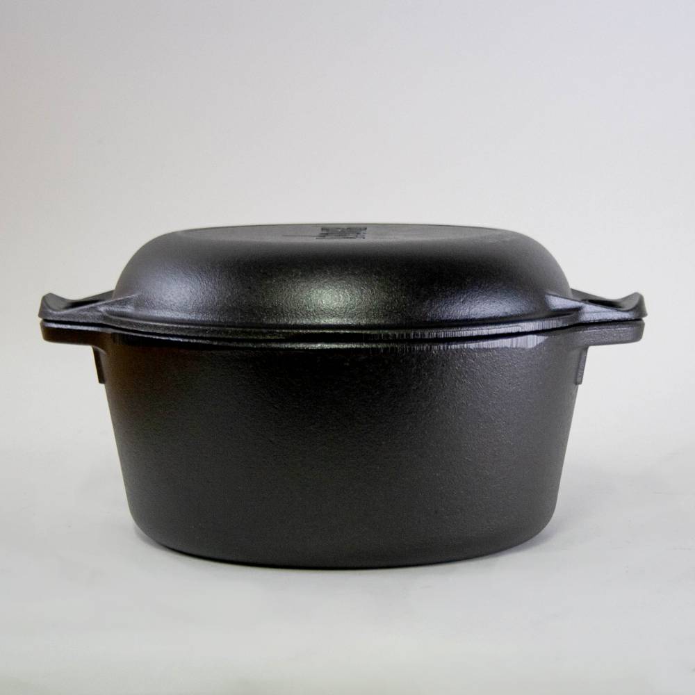 Black cast iron double Dutch oven with lid and side handles for versatile cooking in kitchenware collections
