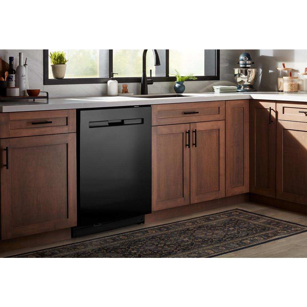 Built-in black dishwasher with top control panel integrated into wooden cabinetry in kitchen appliances and home improvement.