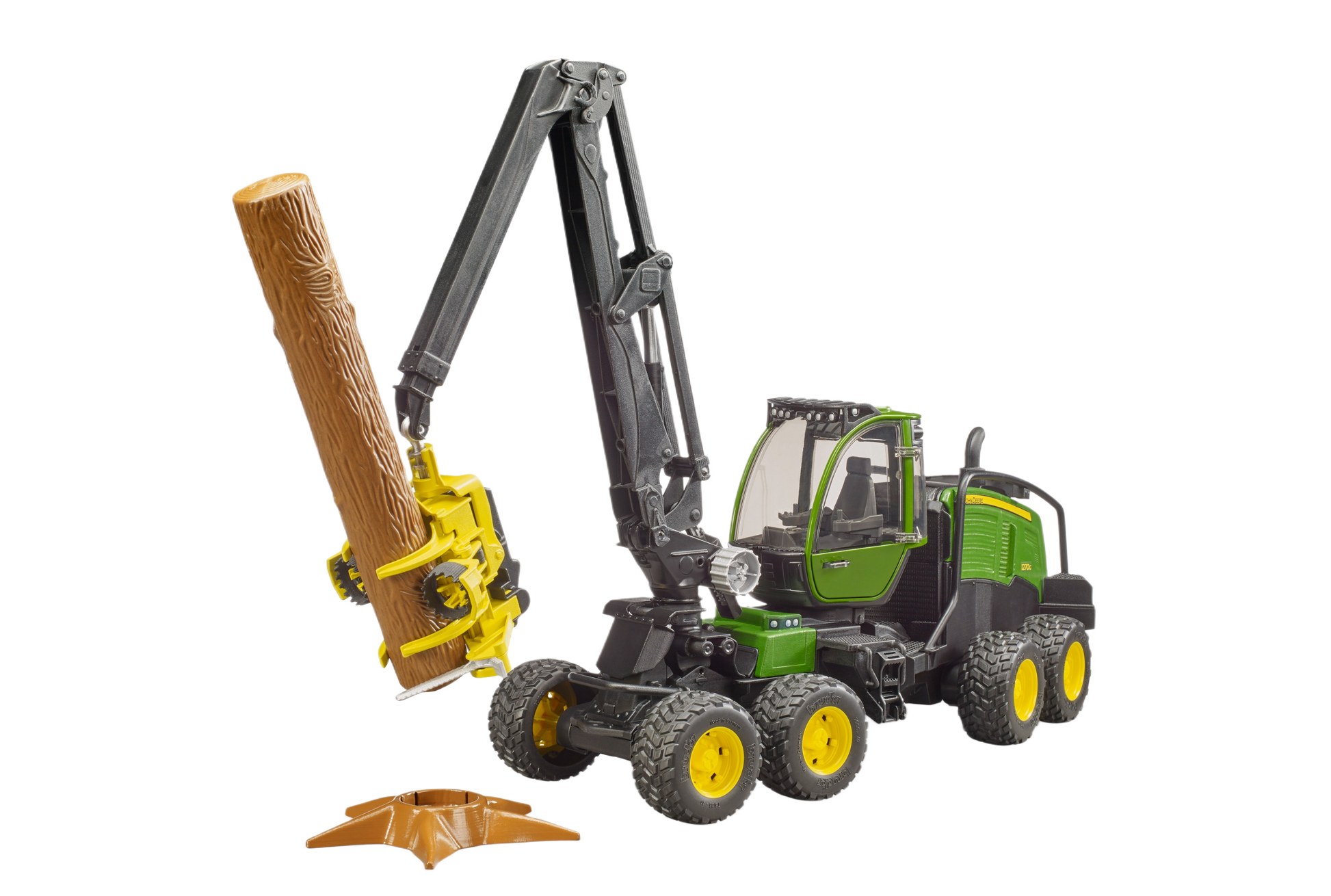 Detailed model of green and yellow wheeled forestry harvester toy lifting a log in Bruder Toys collection