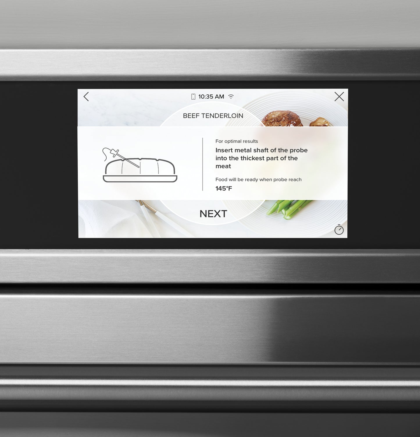 Touchscreen display on stainless steel smart double wall oven showing beef tenderloin probe instructions from kitchen appliances collection