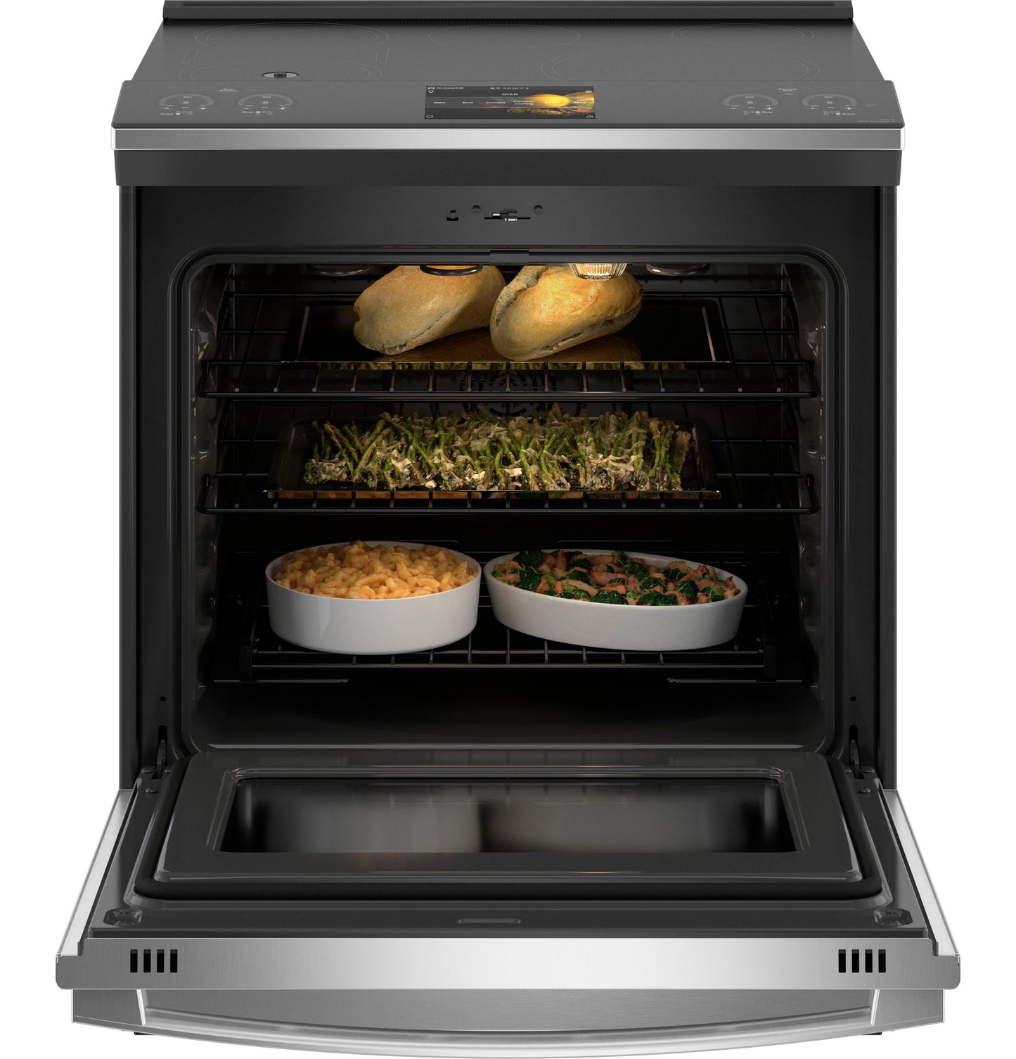 Open stainless steel induction range oven with baked bread and casseroles inside in ranges and kitchen appliances collection